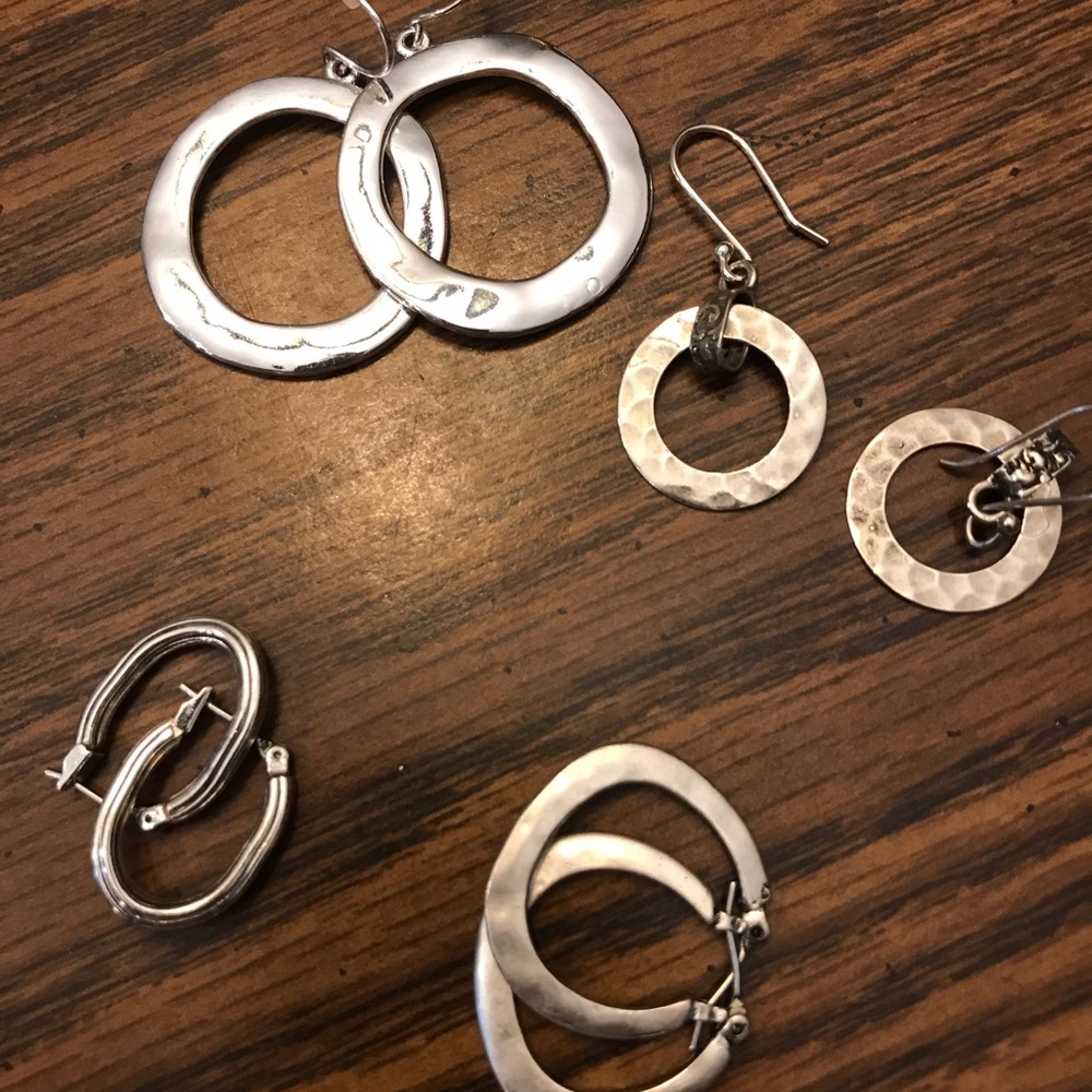 Four (4) pairs of hoop earrings, silver.